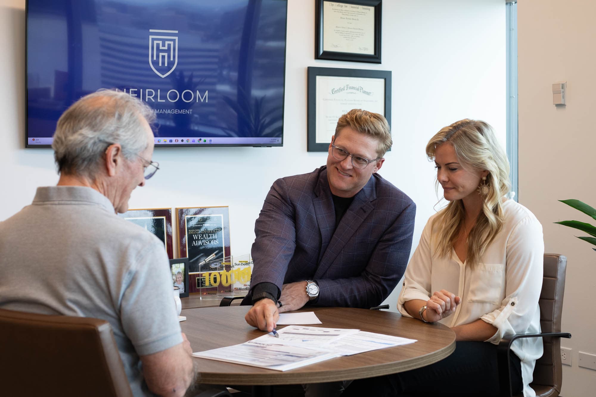 A Heirloom advisor meeting with retirement clients